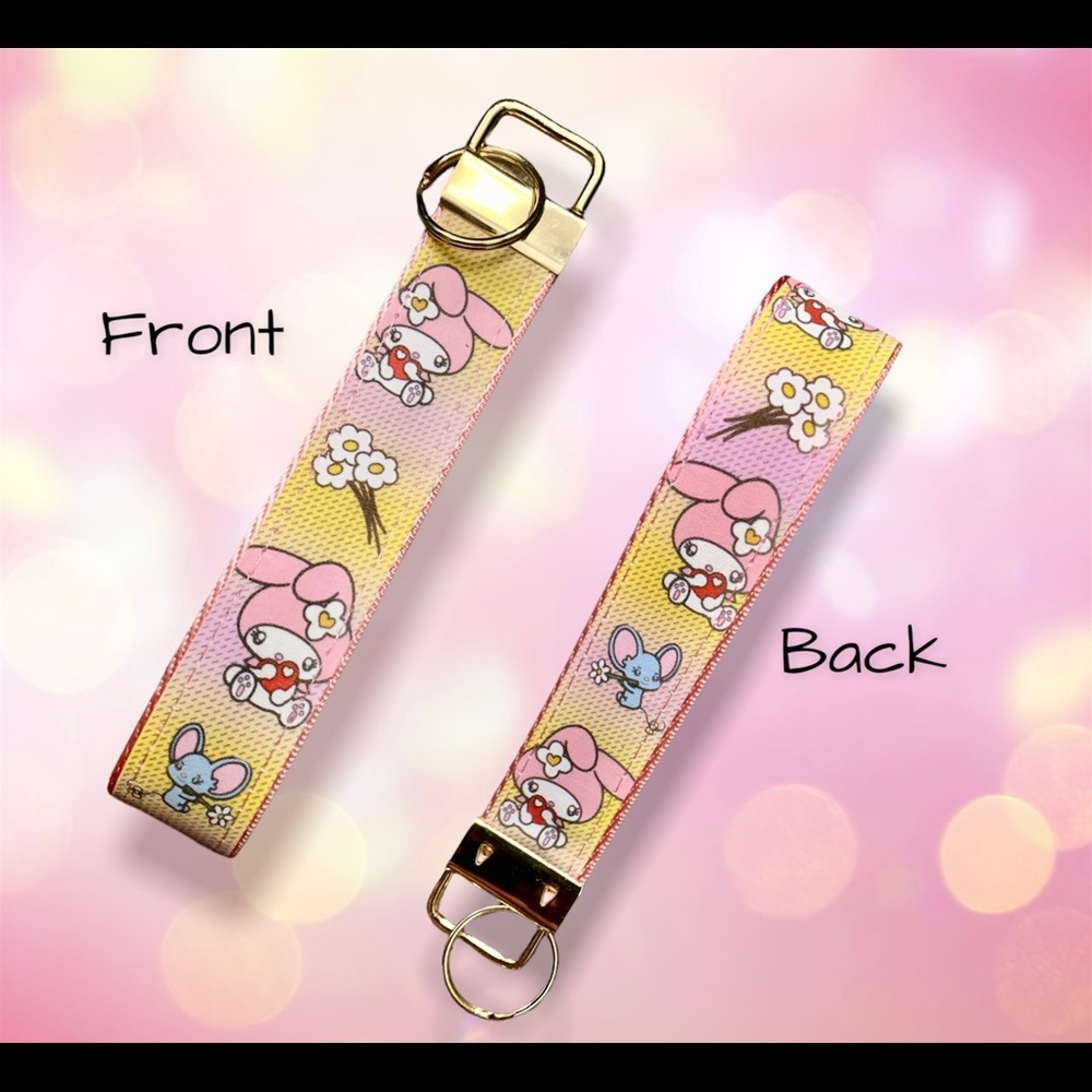 Cute My Melody holding red heart and Flat blue color mouse with flowers wristlet